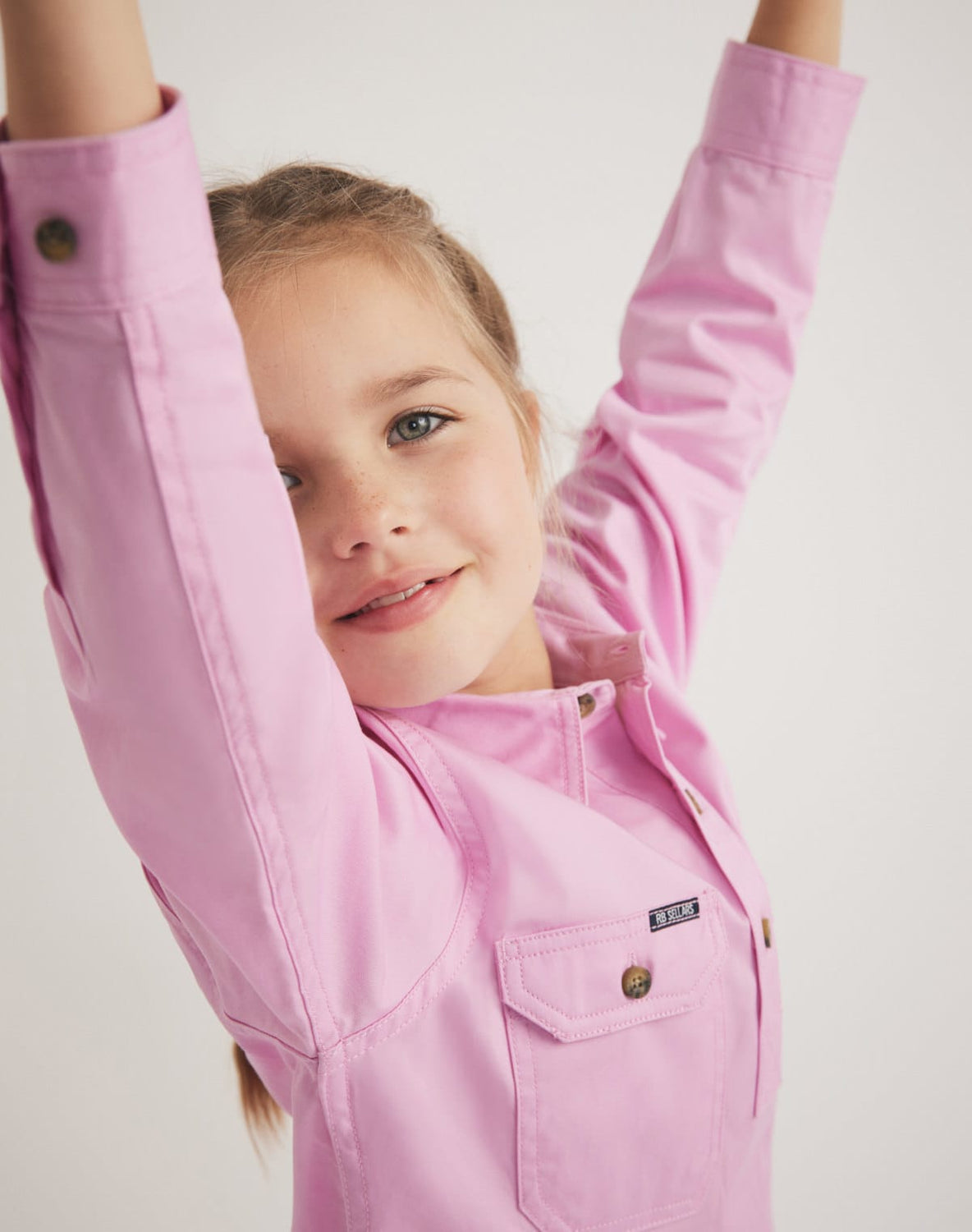 RB Sellars girls' pink cotton twill country shirt – stylish and durable for outdoor play or farm life.