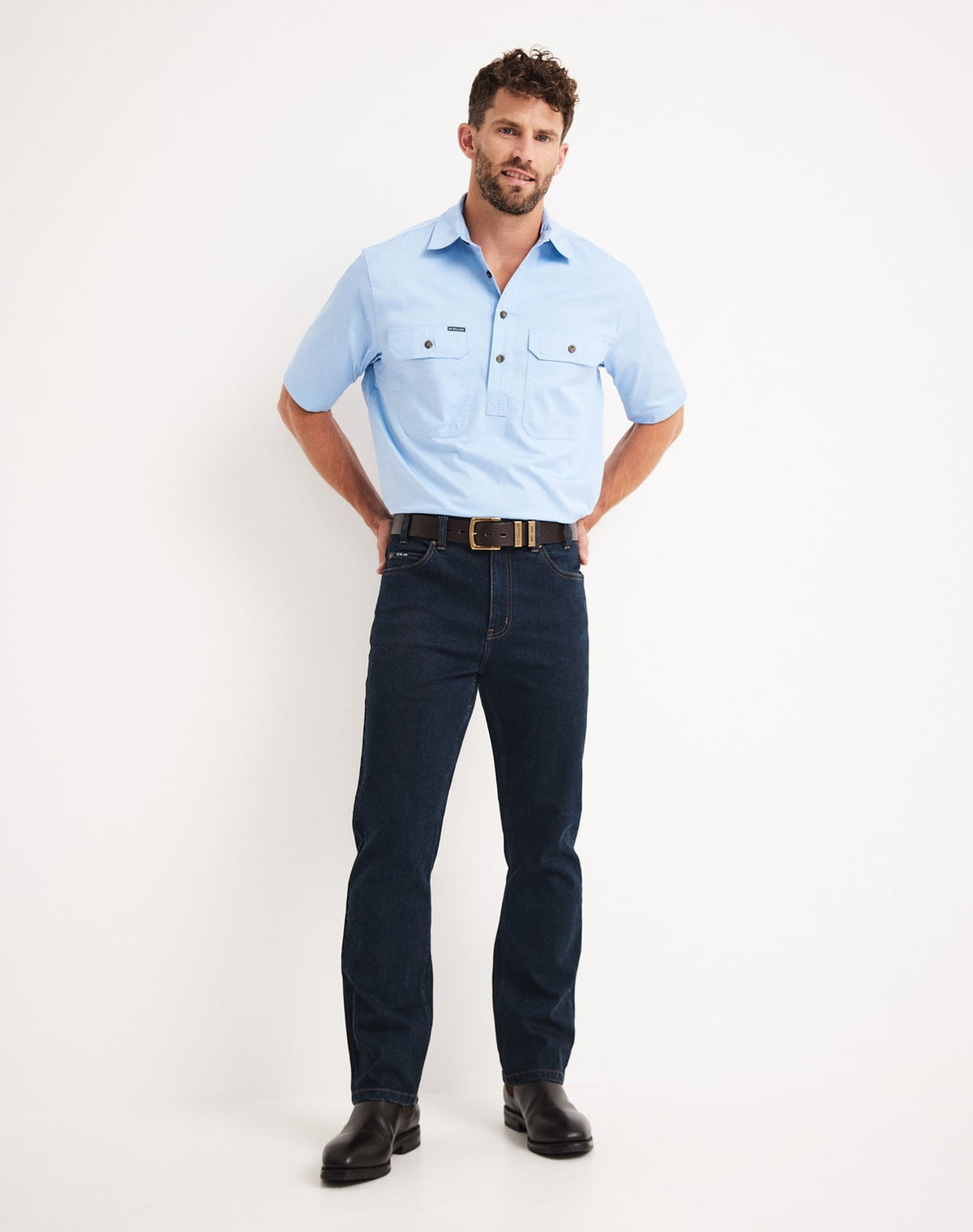 Man wearing a light blue short-sleeve RB Sellars shirt Bleak Ridge Clothing