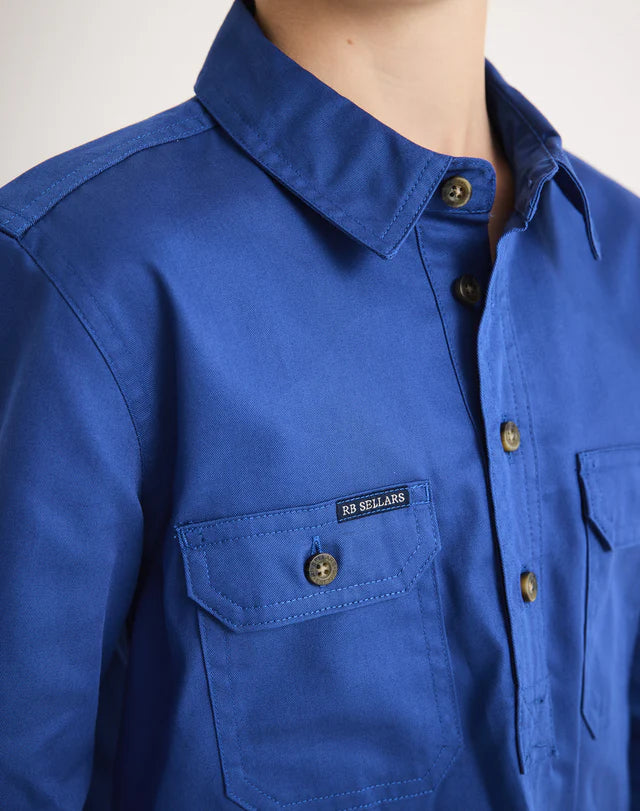 Close Image of an RB Sellars Blue shirt with brand logo on a white background